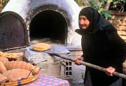 Baking bread the traditional way in a Cyprus village